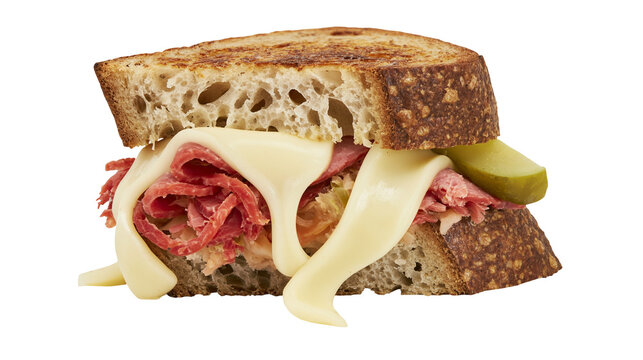 Hearty sandwich with rye bread corned beef melted cheese, sauerkraut and pickle