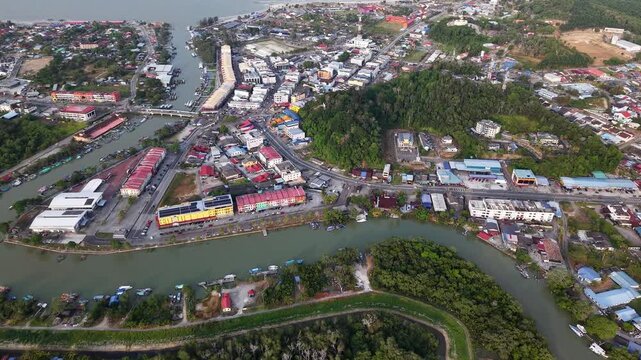 Aerial shot captures rivers flowing through dense coastal buildings
