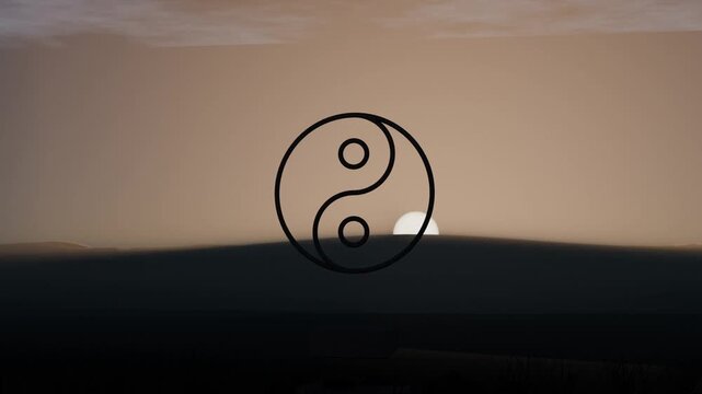 Rising sun starting below horizon climbing above hills at dawn, casting light on yin-yang emblem
