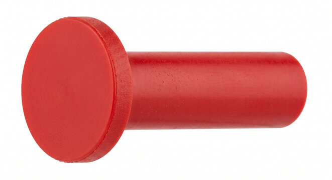 Macro of a red plastic pneumatic blanking plug for air line fittings, isolated on a white background.