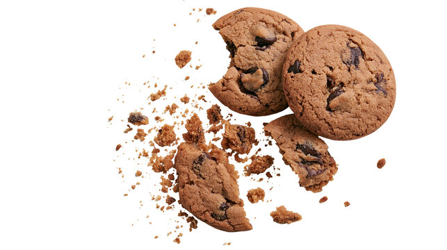 Chocolate chip cookies broken with crumbs scattered