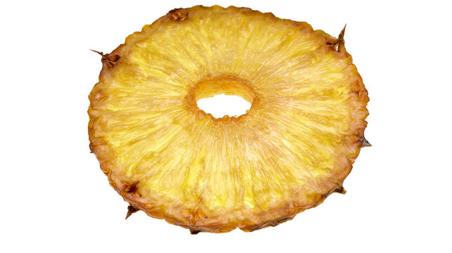 Pineapple slice ring with textured yellow flesh and brown edges