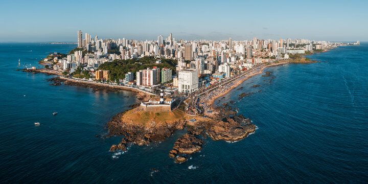 Aerial panorama of the Barra peninsula skyline and the Atlantic coast, Salvador, Bahia, Brazil