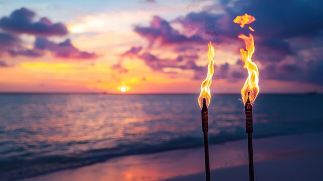Torch flames at sunset beach scene