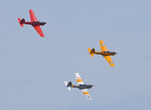 Ickwell, Bedfordshire, England - May 30, 2026: Three Vintage de Havilland Canada DHC-1 Chipmunks aircraft in flight