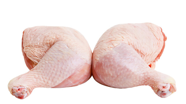 Two raw chicken leg quarters with skin