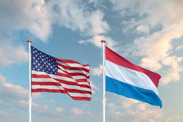 Obraz premium Waving American and Dutch flag in front of a blue sky