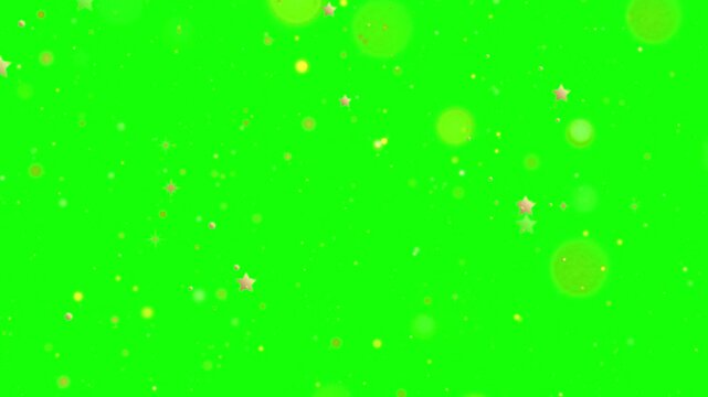 Golden particles and stars falling on green screen background