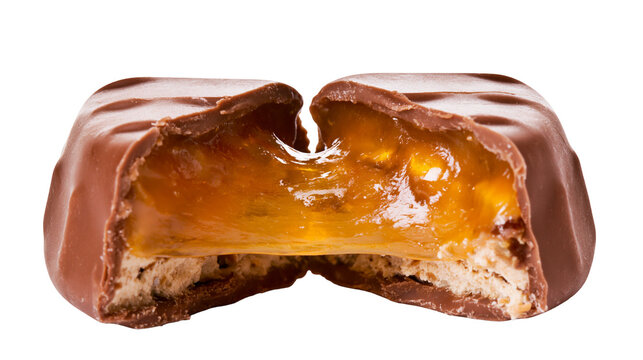 Chocolate bar with gooey caramel and nougat filling cut in half