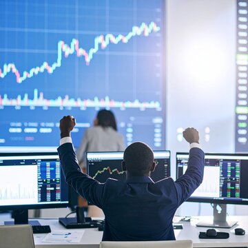 Concept of bullish stock market, traders office at work