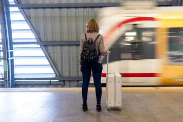 Traveler waiting at train station.