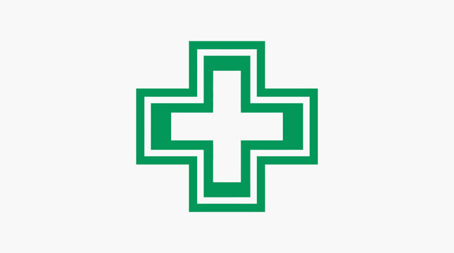 A simple green medical cross symbol isolated on a clean white background