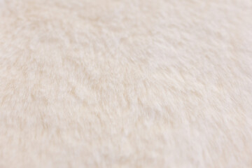 Close up of fluffy white faux fur texture with shallow depth of field © Iryna Miadzvedzeva