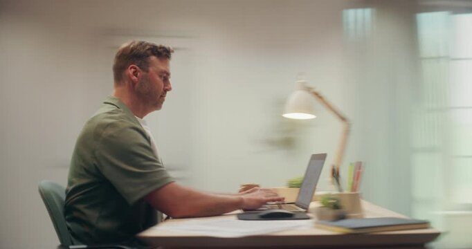 360 Degree Timelapse. Man Works Remotely on Laptop Computer at Cozy Home Desk, Typing Emails, Browsing Internet and Drinking Coffee in Modern Apartment Office. Arc Tracking Shot.