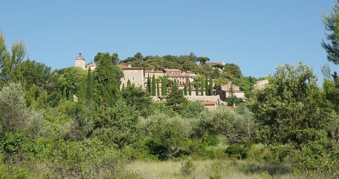 Moissac-Bellevue in Provence, built on a rocky spur. Its church and Clock Tower, its castle and ochre houses lining sloping alleyways overlooking a fertile and verdant plain