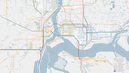 Naklejka premium A detailed map showing a complex urban transport network with multiple colored lines crossing a large river, illustrating city infrastructure.