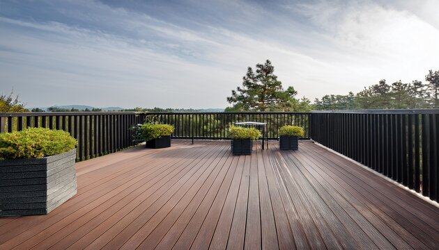 a sleek modern deck with a gray finish and black railings creates a sophisticated outdoor space