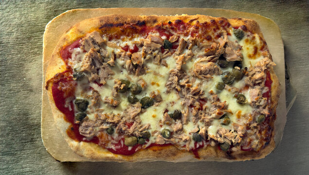 Traditional Roman pinsa with tuna mozzarella and capers