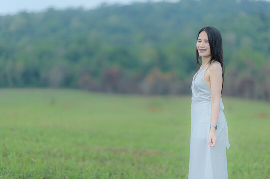 Elegant Woman in White Outfit Enjoying Nature in Khao Yai, Thailand