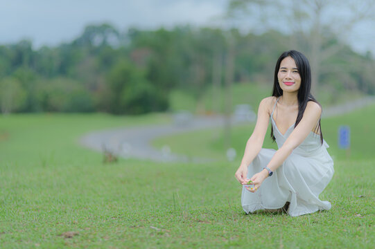Young Woman in White Outfit Exploring Nature in Khao Yai, Thailand