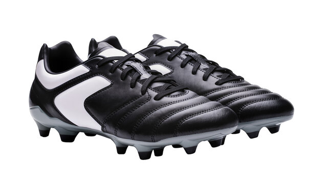 Pair of black and white soccer cleats with laces, isolated on transparent background