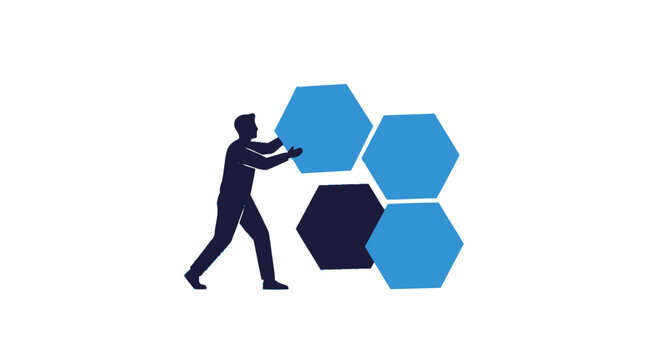 Silhouette of person pushing hexagonal blocks.
