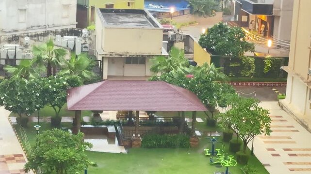 Monsoon Rainfall at Dusk Over Residential Neighborhood in India

