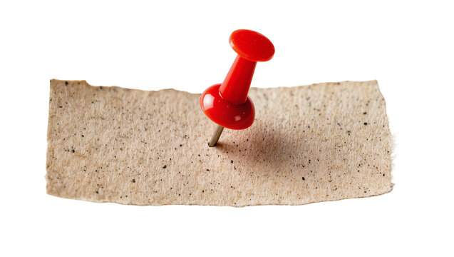 Red plastic thumbtack piercing rough textured paper, isolated on transparent background