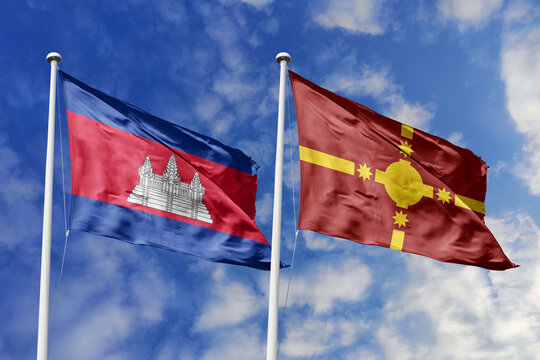 Cambodia and Rotuma flags waving in a clear blue sky, symbolizing a powerful diplomacy, expanding global trade, a strategic partnership, and a shared vision of unity for a sustainable future.