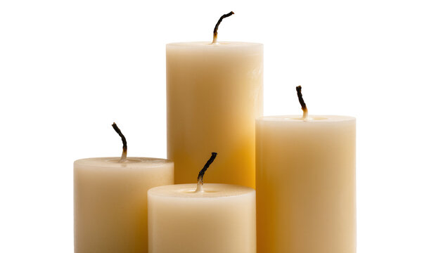 Four unlit cream pillar candles with burnt wicks, isolated on transparent background