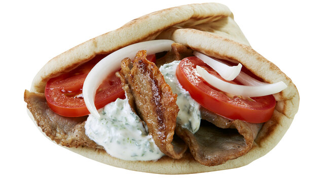 Gyros sandwich with meat tomato onion, and tzatziki sauce