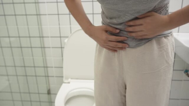 Constipation and diarrhea in bathroom. Hurt woman touch belly  stomach ache painful. colon inflammation problem, toxic food, abdominal pain, abdomen, constipated in toilet, stomachache, Hygiene
