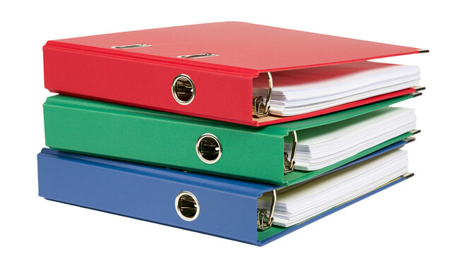 Stack of red green, and blue ring binders with paper