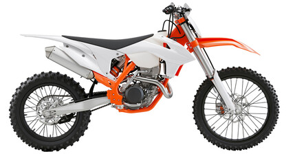 White and orange dirt bike motorcycle with knobby tires © Vetle