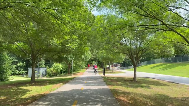 Biking along multi use Swamp Rabbit Trail on the way from Greenville to Travelers Rest in South Carolina
