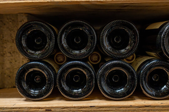 Wine bottle bases stacked in crates