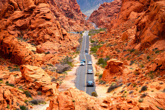 Valley of Fire State Park is a public recreation and nature preservation in Nevada (USA) in the Mojave Desert, near Las Vegas. Panoramic wide angle view of the road in colorful red sandstone scenery.