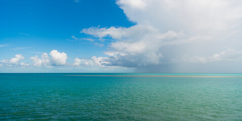 Fototapeta premium Calm horizon view at sea nature. Romantic summer vacation view on seascape. Sea horizon view. Cloudy sky and seascape at summer vacation. Skyscape with sea horizon. Travel destination
