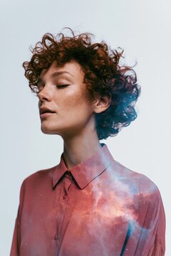 Close up portrait of a redhead woman with nebula overlay for surreal background and fashion banner design and dreamy editorial wallpaper