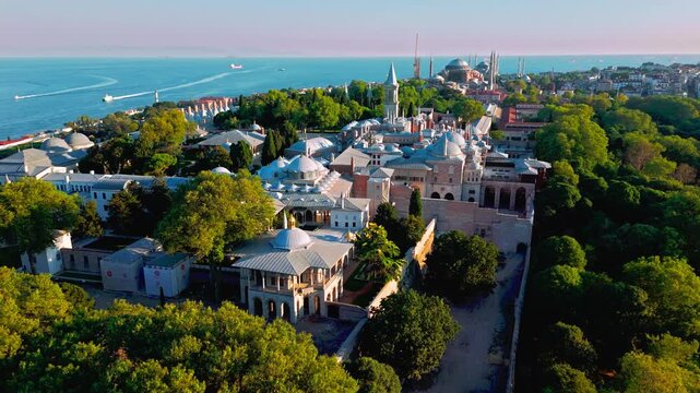 Aerial view of Topkapi Palace Museum in Istanbul, Turkey. The landmark is framed by leafy gardens, palace rooftops and sweeping views across the historic peninsula.