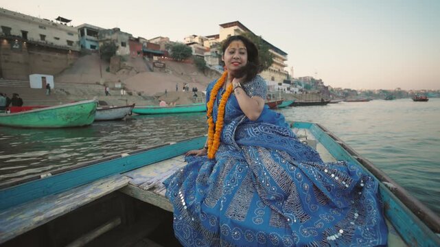 An Indian Traditional girl on a Boat in Ganga River Varanasi Video