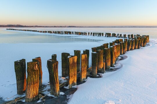 Ice on the frozen dolmen in winter, Lembruch, Lower Saxony, Germany