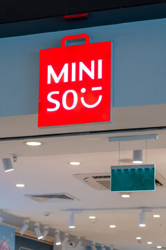The signboard MINISO store. Miniso brand retail store logo sign. Miniso signage above the entrance to the shop. Minsk, Belarus - March 30, 2026