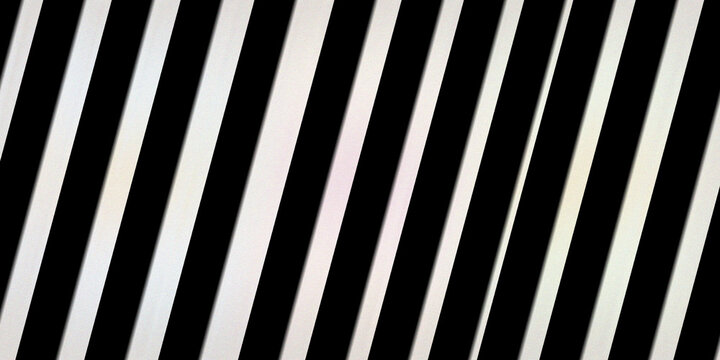 Classic black and white diagonal stripes background with sharp contrast and repetitive parallel lines creates bold optical effect.