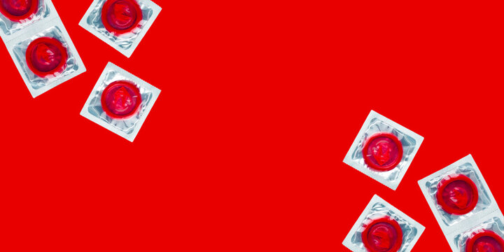 Red condoms on white packets contraceptives protection