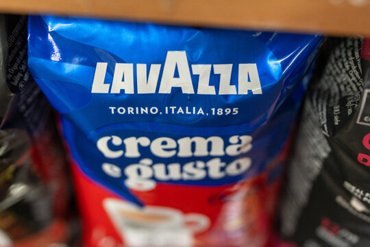 Closeup of the Lavazza logo seen on a bag of Lavazza "Crema e gusto". Lavazza coffee beans in a package on a store shelf. Minsk, Belarus - May 6, 2026