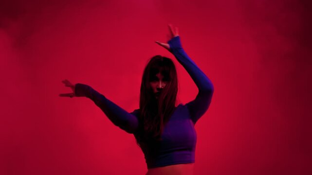 Contemporary dance expressive pose in red haze