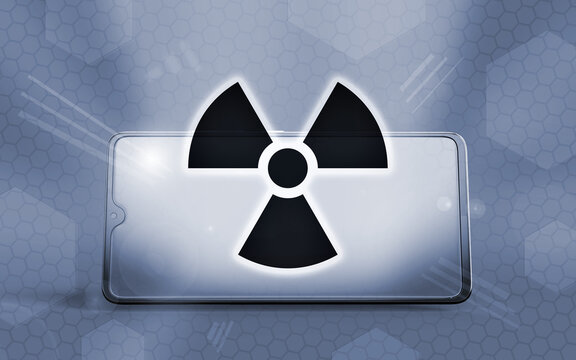 Representaci&oacute;n 3D de un tel&eacute;fono inteligente moderno mostrando el s&iacute;mbolo de radiaci&oacute;n brillante en su pantalla, destacando conceptos de seguridad nuclear, peligros tecnol&oacute;gicos y energ&iacute;a at&oacute;mica.