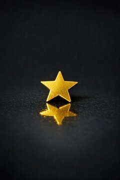 A single gold star on a dark background