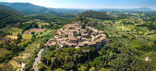 Casperia Rieti Italy Drone. Traditional medieval borgo town panorama on hilltop side view among green fields valleys. Authentic beautiful village - borghi più belli d'Italia hidden gems travel asset © Freesurf